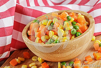 Close up of a wooden bowl of delicious mixed vegetables Stock Photo