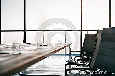 Close up of wooden conference table ready for meeting with in the morning office Stock Photo