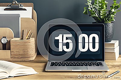 Close-up of wooden desk for remote work with books, fresh potted Stock Photo