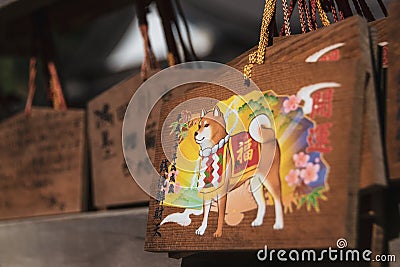 Close-up on a wooden `Ema` votive plaques. Editorial Stock Photo