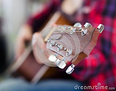 Close-up of wooden fretboard of guitar Stock Photo