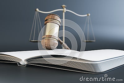 Close up of wooden gavel, scales and book/journal on gray background. Lawyer, justice and punishment concept. Stock Photo