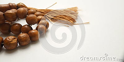 Close up Wooden Tasbih, Islam People prayer bead at white Background with negative space for text placement area Stock Photo