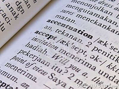 a close up of the word accept in the English to Indonesian dictionary. For language background or wallpaper Stock Photo