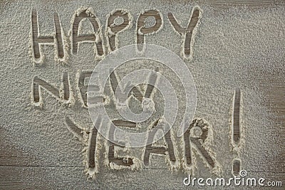 The word happy new year written on sprinkled flour Stock Photo