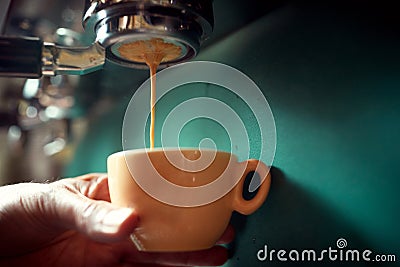 Close up of a worker making coffee Stock Photo