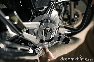 Close up of wrench near motorcycle Stock Photo