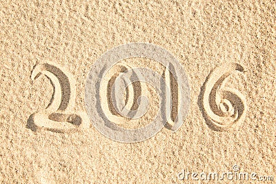 Close up on 2016 written in the sand Stock Photo