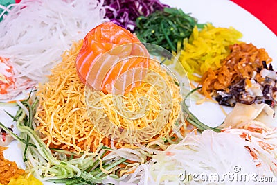 Close-up of Yee Sang or Yusheng with raw salmon fish Stock Photo