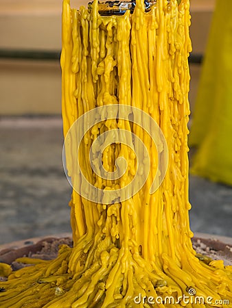 Close up yellow candle drippings Stock Photo