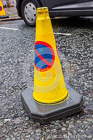 Close up of yellow no waiting traffic cone Wigan Lancashire July 2019 Editorial Stock Photo