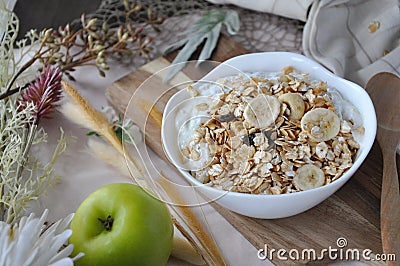 Close up Yogurt Granola Bowl on Wooden Board Stock Photo