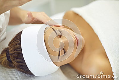Close-up of young beautiful womans face without makeup during skin examination Stock Photo