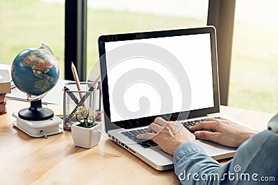 Close up of Young business woman sitting at desk and working on Stock Photo