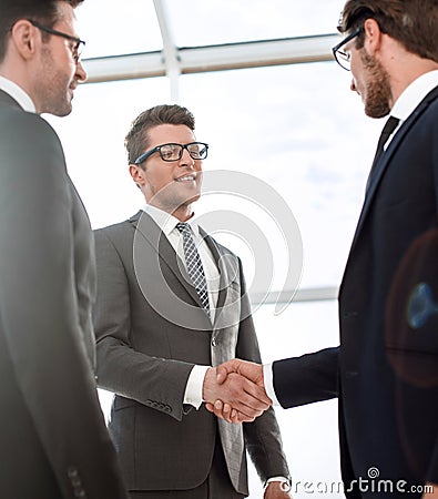 Close up.young businessman shaking hands with investor Stock Photo