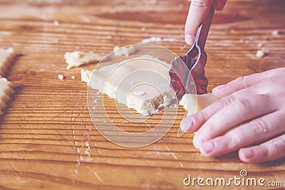 Close up young little chef girl apron preparing sweet dessert at home kitchen. Nutrition and food concept Stock Photo