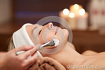 Close up of young woman and cosmetologist in spa Stock Photo