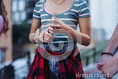 Close up of a young woman& x27;s injured wrist with a plastic brace on. Stock Photo