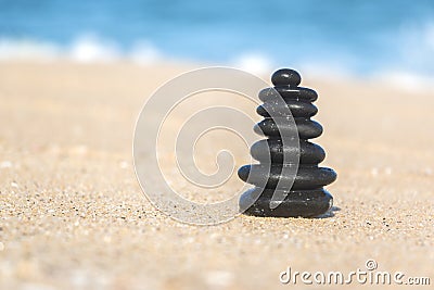 Close-up of Zen Stacked Pebbles on Sandy Beach Stock Photo