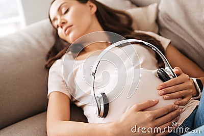 Close upof a pregnant young woman Stock Photo