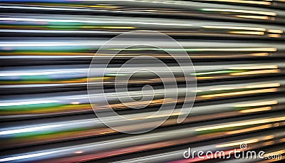 Close-ups of colorful reflective industrially manufactured metal pipes stored next to each other after production Stock Photo