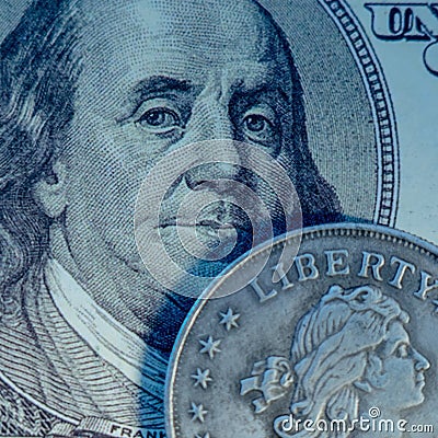 Close uup one hundred US Dollar bill and coin with description: Liberty as symbol: America - the land of opportunities and freedom Stock Photo