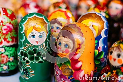 Close Varicoloured Matryoshka, Russian Nesting Dolls, Famous Old Wooden Souvenir At Shop Showcase Editorial Stock Photo