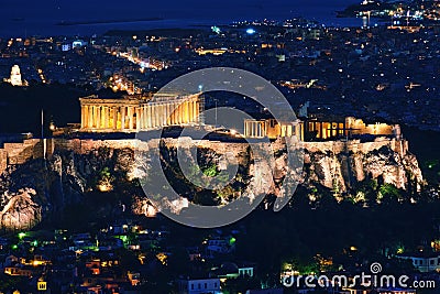 Close view of Acropolis, Parthenon and Erechtheion, Philoppapos monument at night. City lights of Athens. Famous view of Editorial Stock Photo