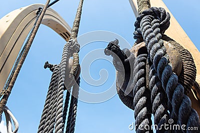 Close view of block and tackle, rope rigging on an old ship Stock Photo