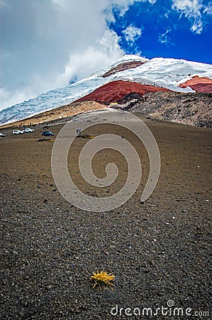 Close view of the Cotopaxi volcano, it`s slopes, rocks and safe house, on an cloudy yet sunny day, Cotopaxi National Park, Ecuador Stock Photo