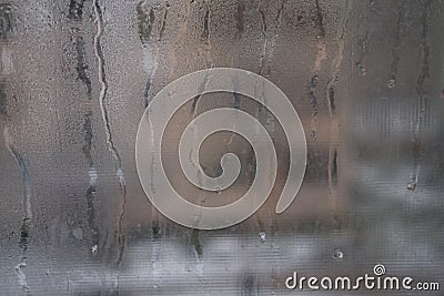 Close view of a distinctly dirty window showing grit, grime, streaks and opacity. Stock Photo