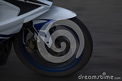 A close view of a front wheel of a motorbike Editorial Stock Photo