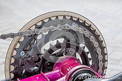 View of the gear cogs which are attached to the pedals of a bicycle Stock Photo