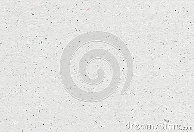 Close of view of grey paper recycled background with inclusions of paper particles. Stock Photo