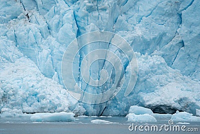 Close view of Holgate Glacier shows deep crevasses and icebergs Stock Photo