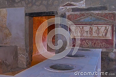 Close view inside ancient eating house in Pompeii, Italy Stock Photo