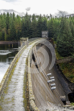 A close view of Laggan Dam wall, spillway and pipes, Scotland Editorial Stock Photo