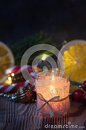 Close view Magic Christmas decorated Burning candle on wooden rustic background Stock Photo