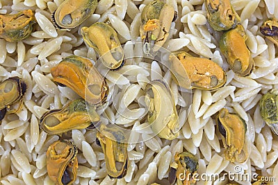 Close view marinated mussels on orzo Stock Photo