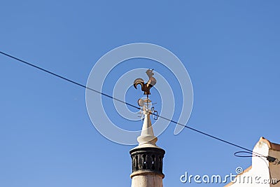 Cock rooster on top of chimney Stock Photo