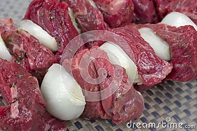 Close view onions and beef kabobs Stock Photo