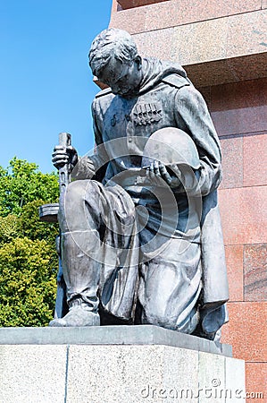 Close view of a soldier kneeling at the middle portal at Soviet War Memorial at Treptow. Editorial Stock Photo