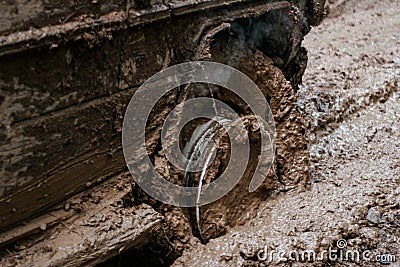 Close of view of a very muddy wheel after off road driving through the dirt and mud. Stock Photo