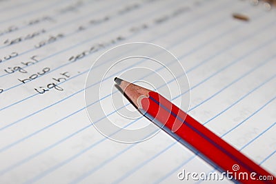 Close view of the writings and the pencil used in a notebook Stock Photo