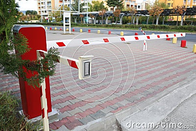 Closed automatic boom barrier with control panel outdoors Stock Photo