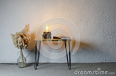Closed black book Holy Bible on the table. Loft style lamp. In room. Desktop. Office. Stock Photo