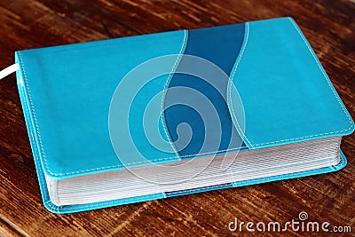 Closed book on wooden background Stock Photo