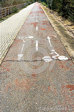 Closed and broken bike lane with worn out bike symbols Stock Photo