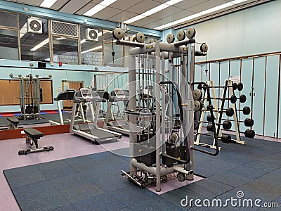 3 11 2021 closed and empty sport center with Modern light gym, equipment, Barbells of different weight on rack in university of Editorial Stock Photo