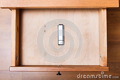 Closed flash drive in open drawer Stock Photo